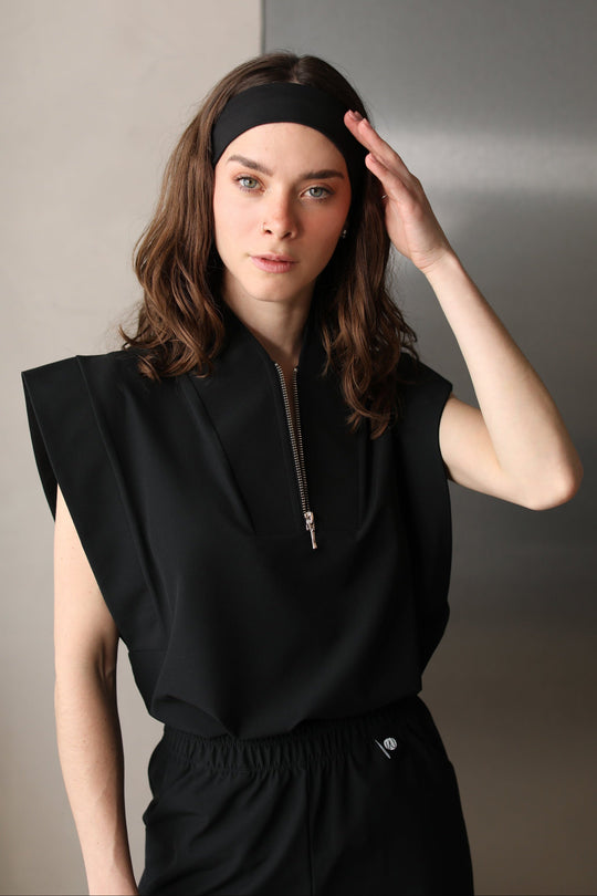Woman wearing Black Chill Band with black Work &amp; Chill scrubs