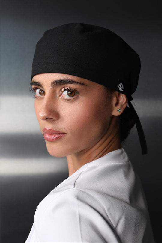 Woman wearing Black Women’s Surgical Cap by Work &amp; Chill