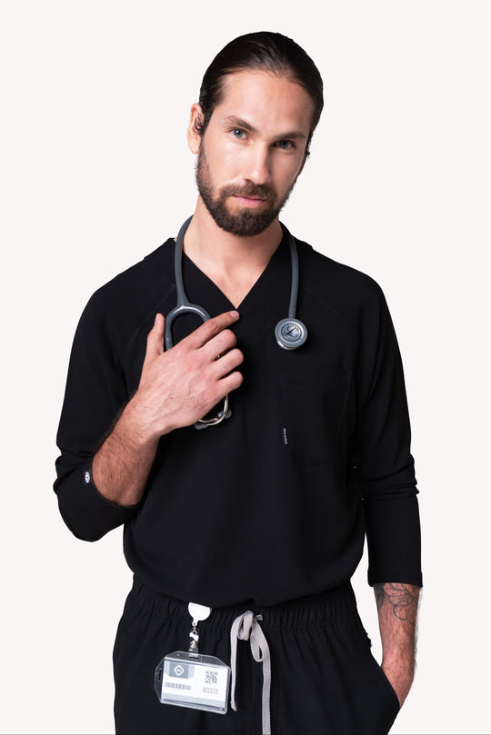 Man wearing Classic Black Scrub Top by Work &amp; Chill