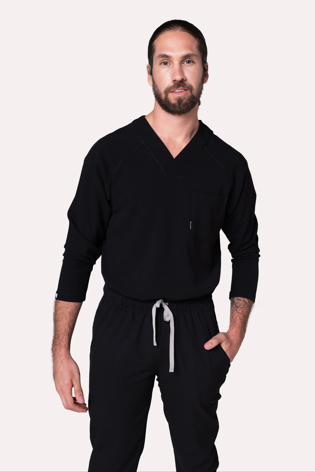 Front view of Classic Black Scrub Top showing the straight fit and V-neckline
