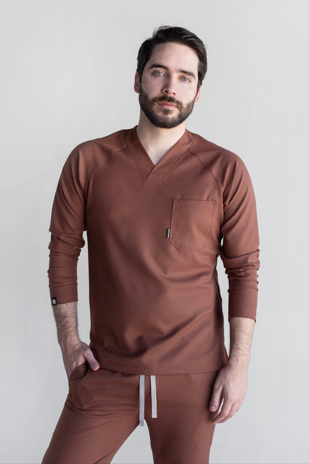 Man wearing Classic Cocoa Scrub Top by Work &amp; Chill