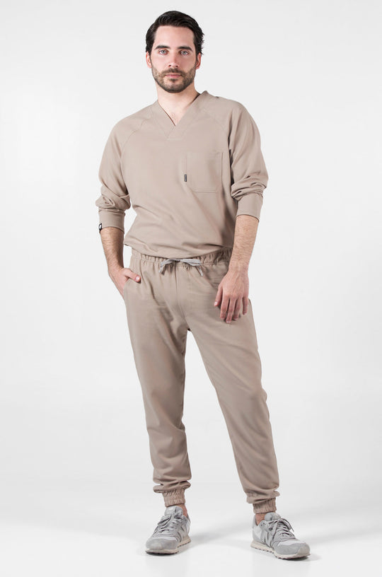 Model wearing Classic Natural Scrub Top with matching natural scrub pants