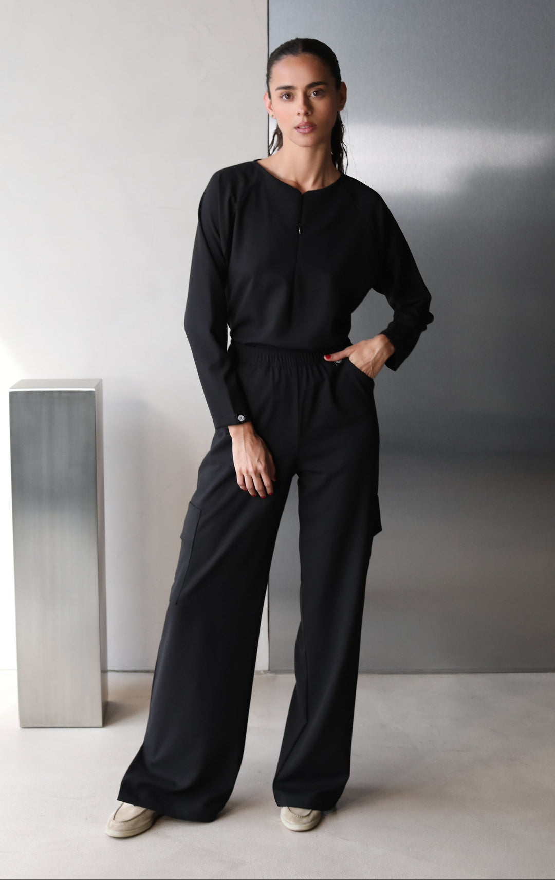 Front view of Fall Black Scrub Top showing the long-sleeve fit
