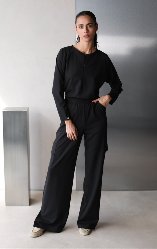 Front view of Fall Black Scrub Top showing the long-sleeve fit