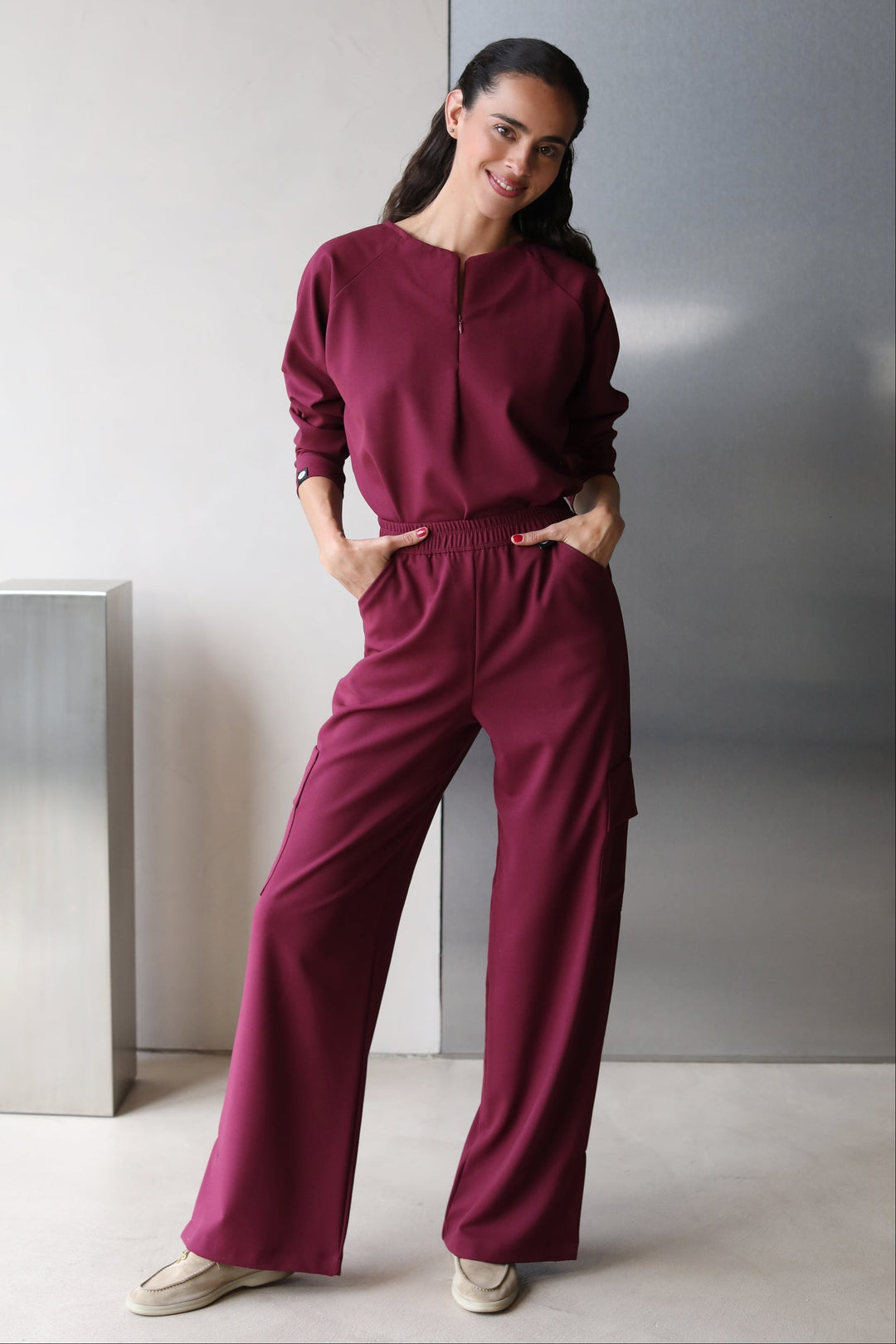 Side view of Fall Burgundy Scrub Top showing the long-sleeve fit