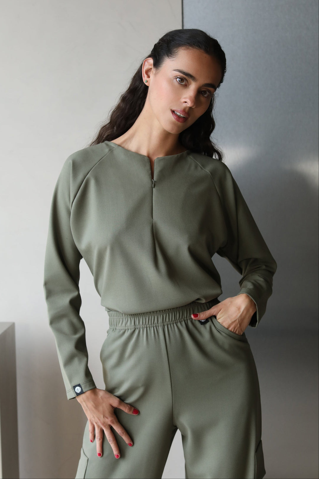 Woman wearing Fall Olive Scrub Top by Work & Chill