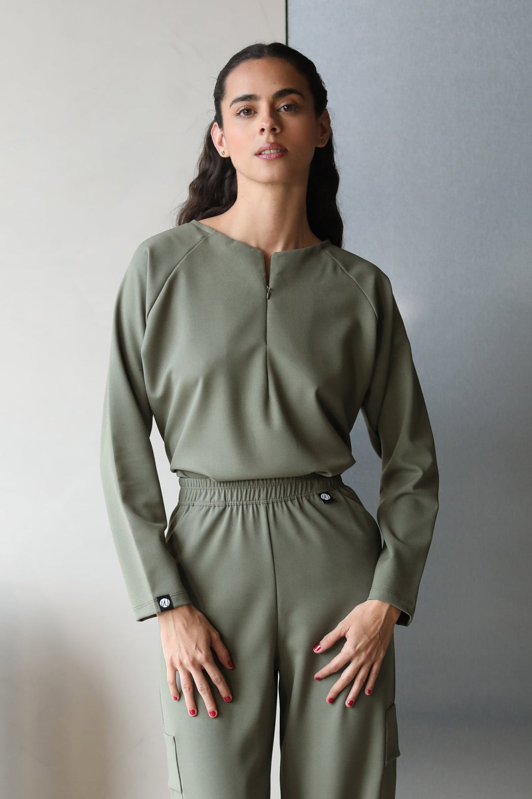 Model wearing Fall Olive Scrub Top with matching scrub pants
