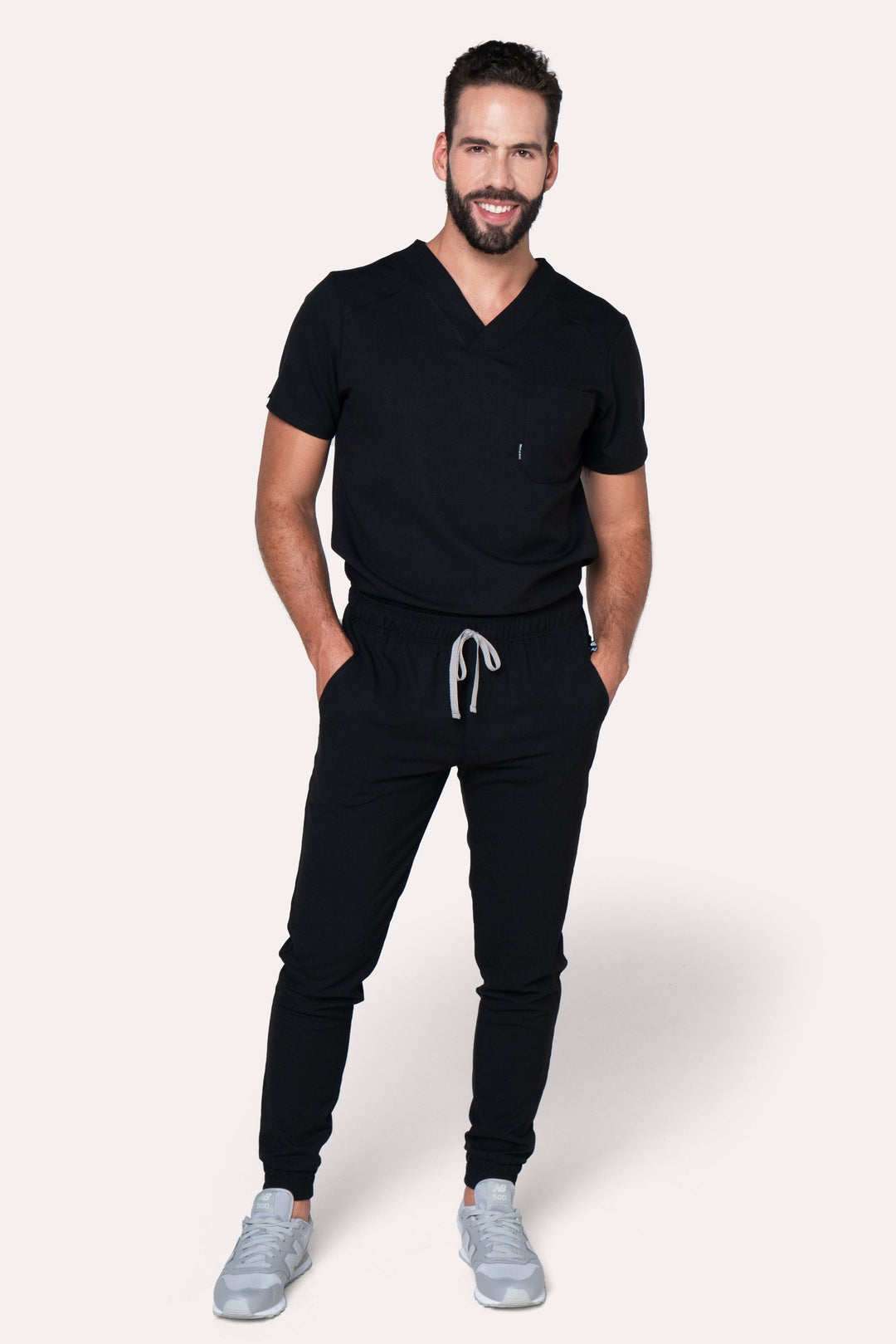 Model wearing Fresh Black Scrub Pants with matching Fresh Scrub Top