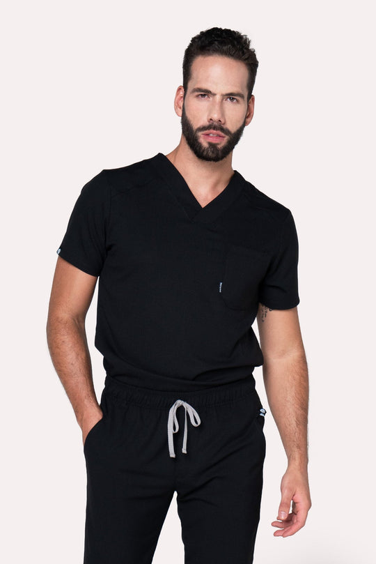 Model wearing Fresh Black Scrub Top with matching Fresh Scrub Pants