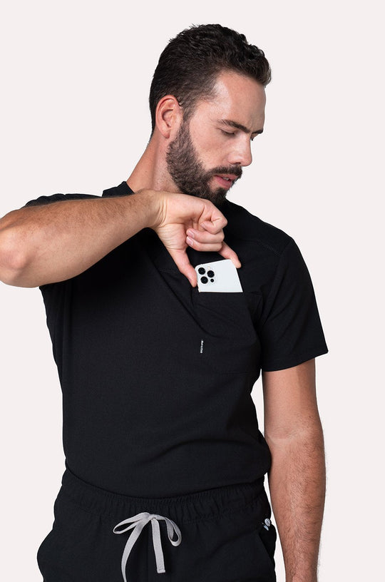 Man wearing Fresh Black Scrub Top showing the V-neckline and comfortable fit