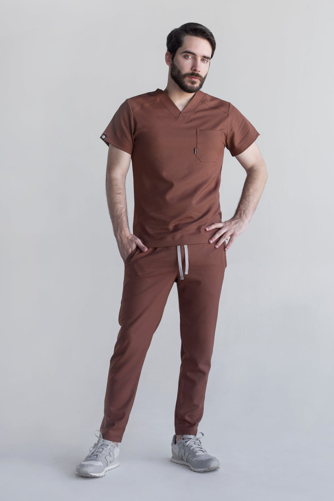 Man wearing Fresh Cocoa Scrub Pants showing the tapered jogger silhouette