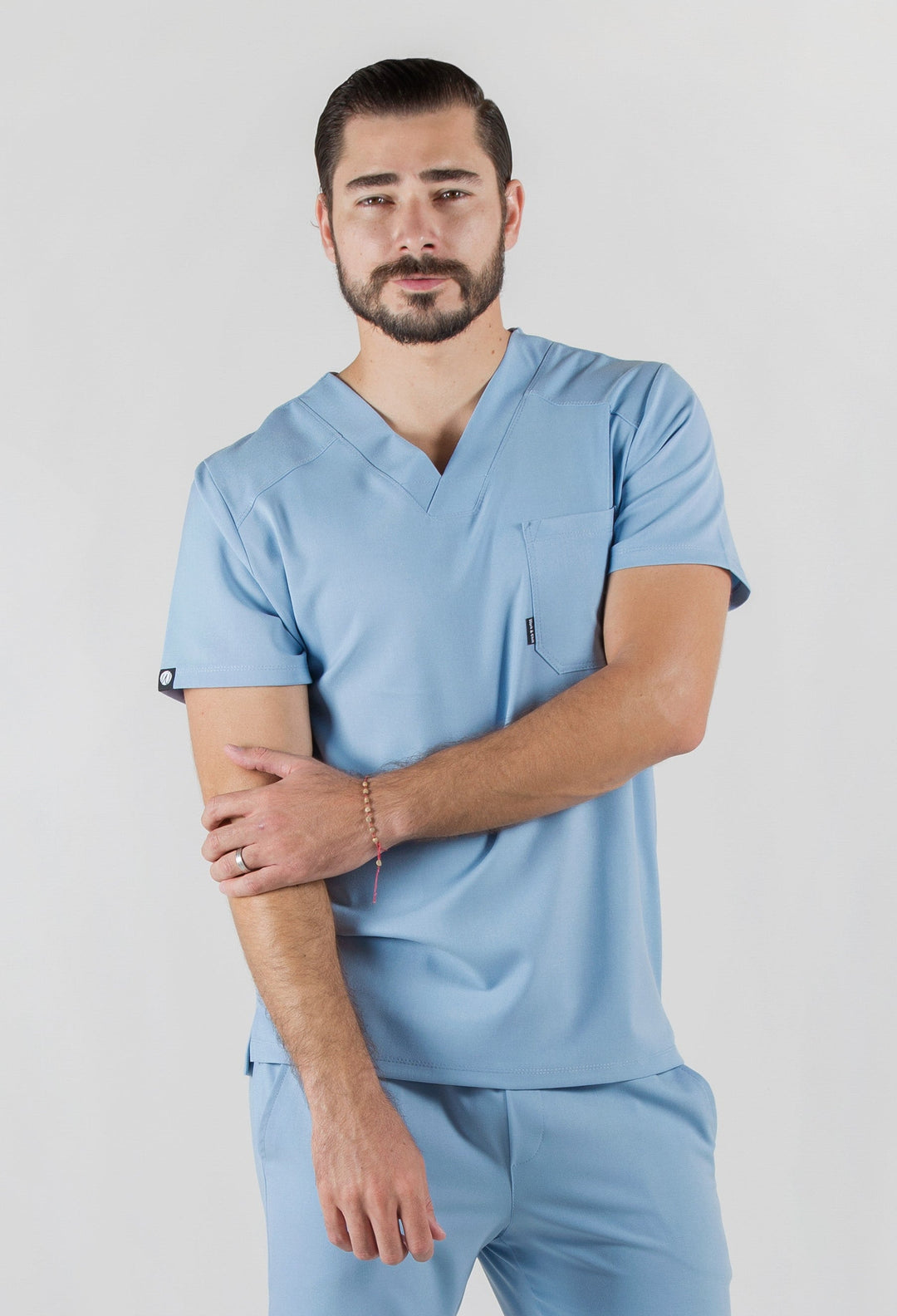 Model wearing Fresh Dream Blue Scrub Top with matching Fresh Scrub Pants