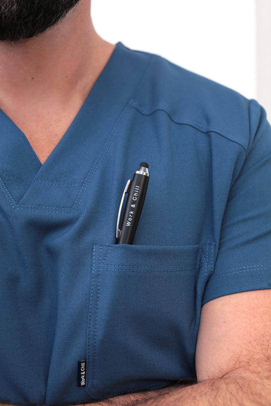 Close-up of Fresh Indigo Scrub Top showing the chest pocket detail