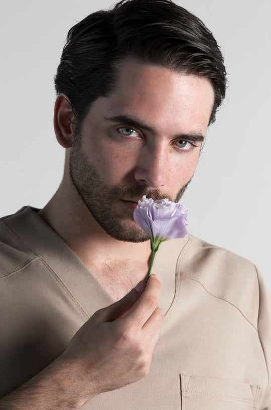 Man wearing Fresh Natural Scrub Top showing the relaxed fit and V-neckline