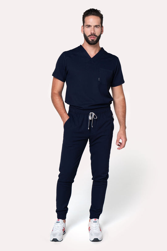Model wearing Fresh Navy Scrub Pants with matching Fresh Scrub Top