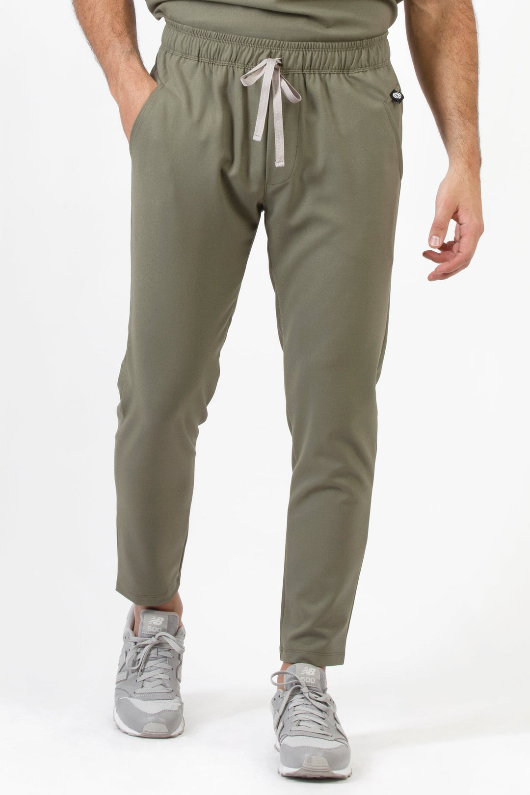 Front view of Fresh Olive Scrub Pants showing the jogger fit and drawstring waist