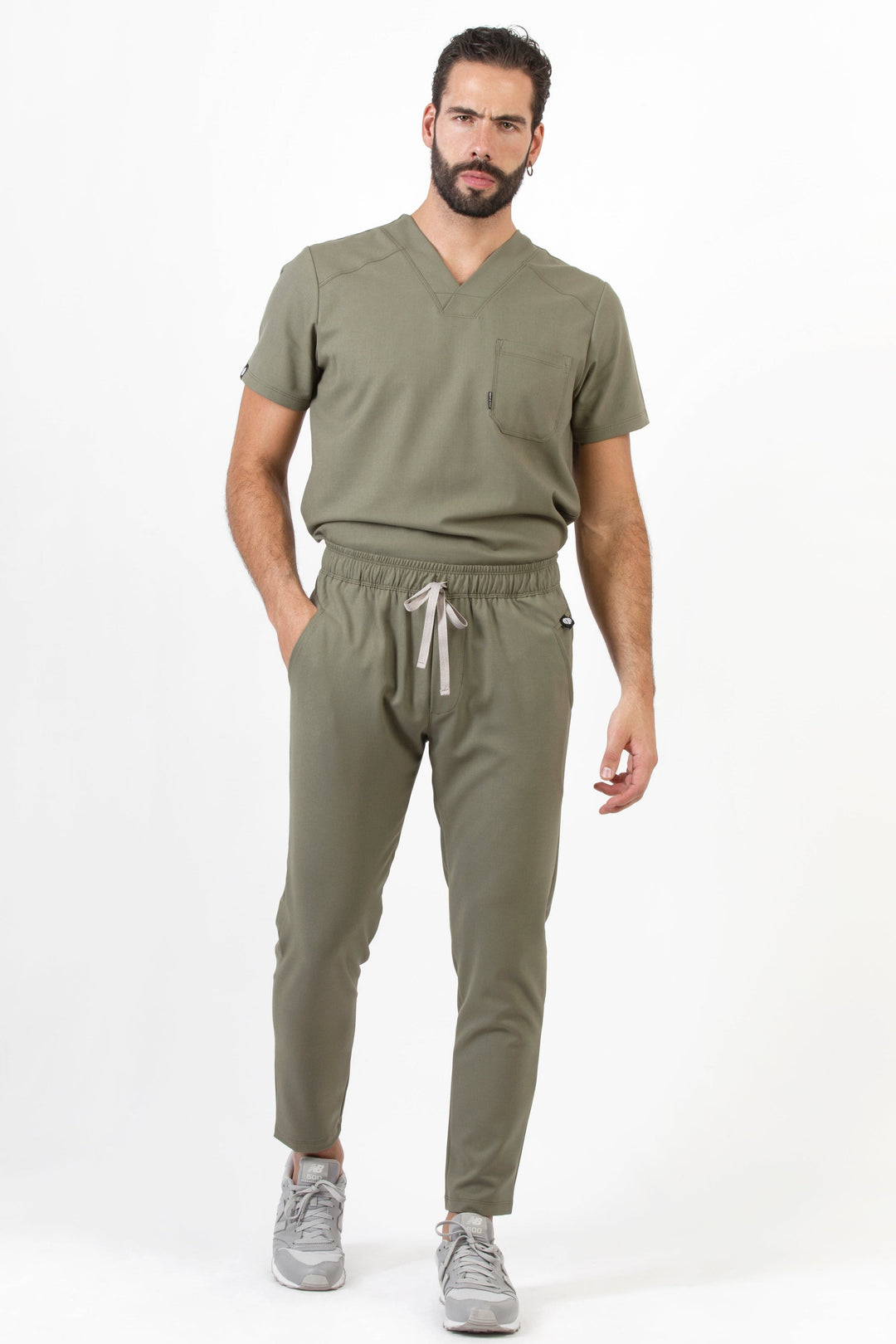 Man wearing Fresh Olive Scrub Pants showing the tapered jogger silhouette