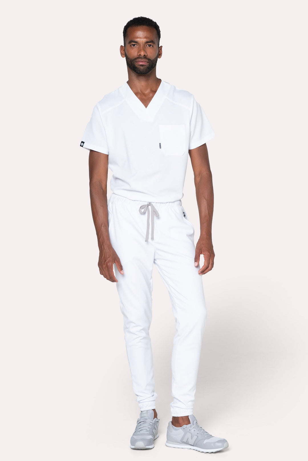 Model wearing Fresh White Scrub Pants with matching Fresh Scrub Top