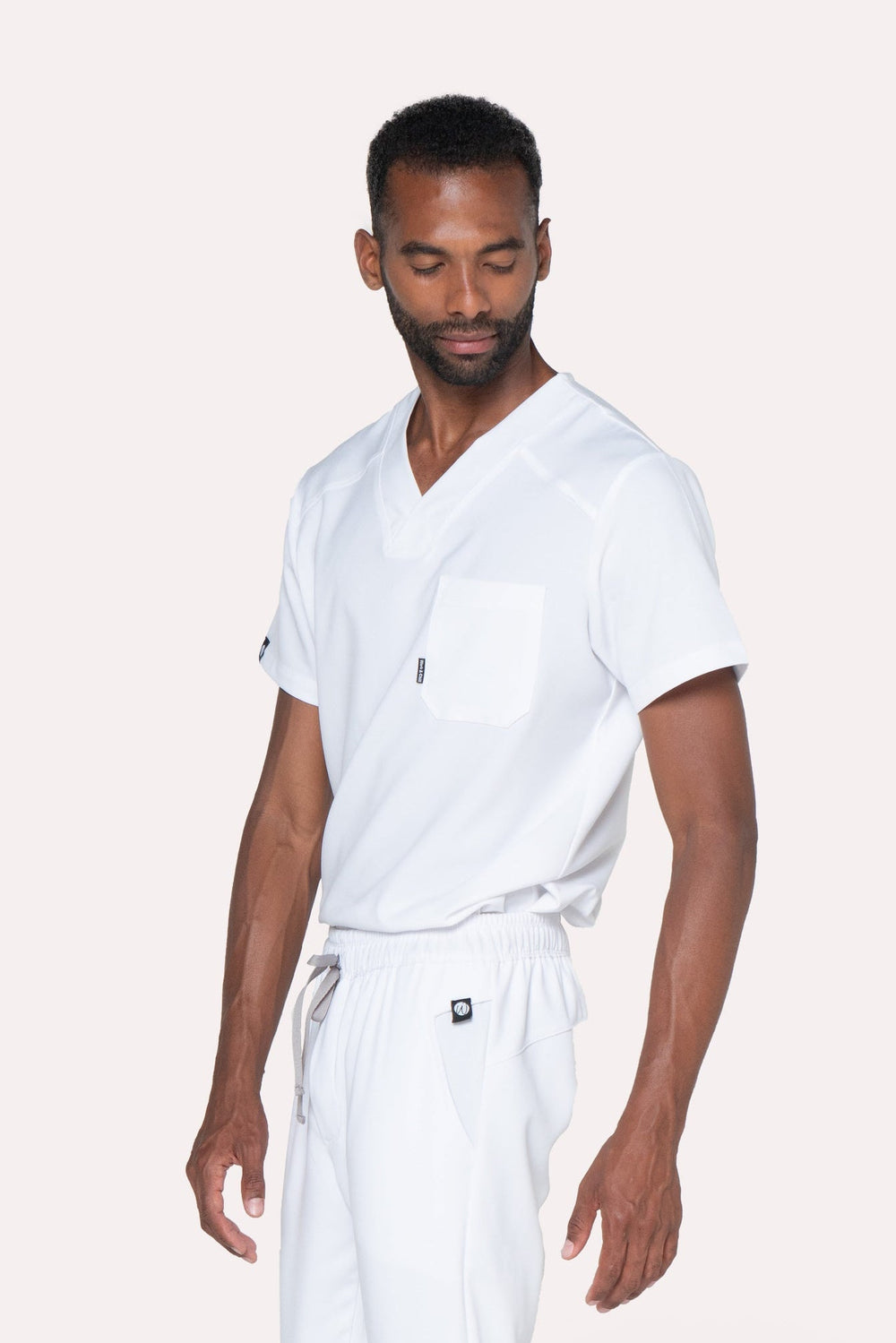 Model wearing Fresh White Scrub Top with matching Fresh Scrub Pants