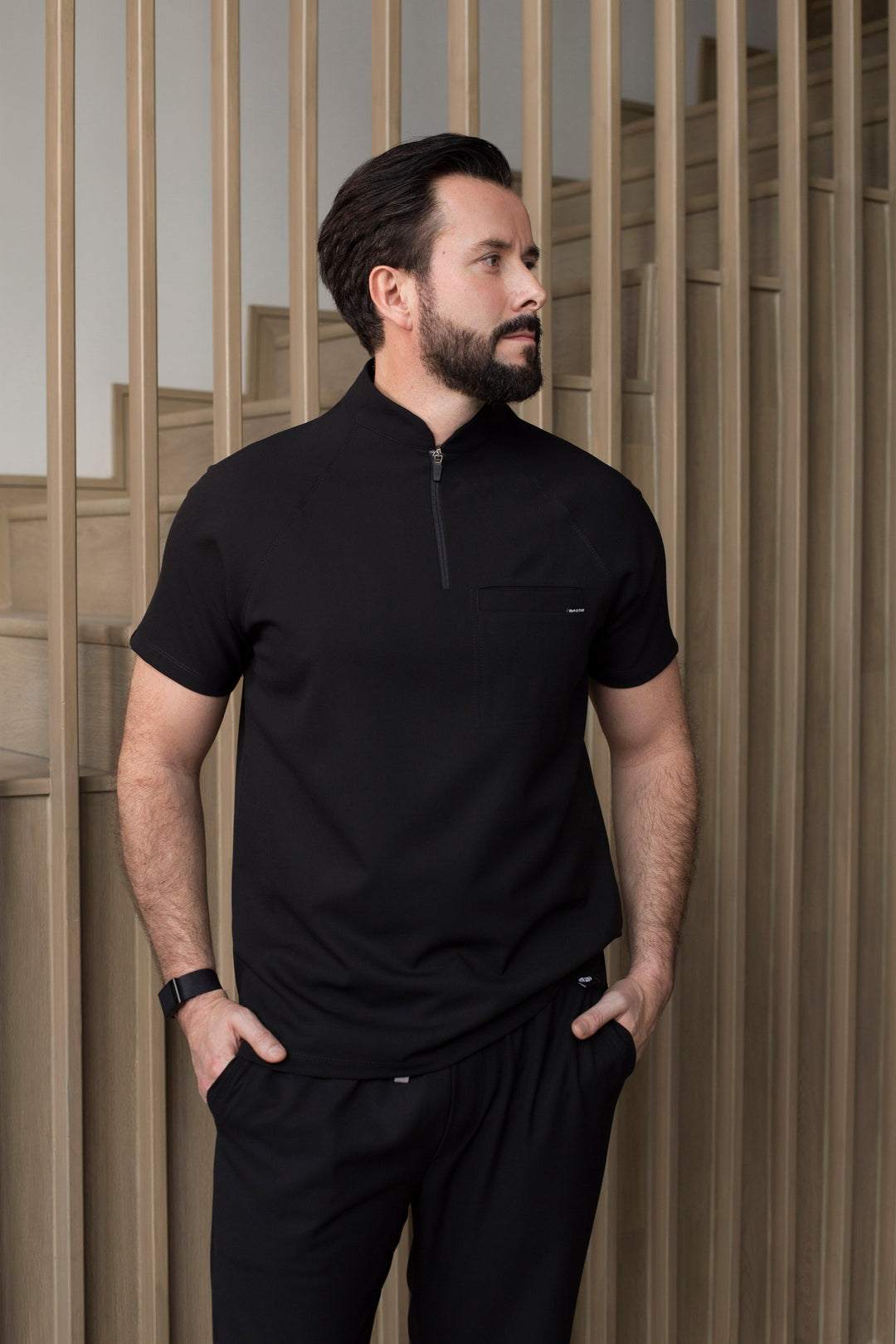 Side view of Harry Black Scrub Top showing the tailored fit