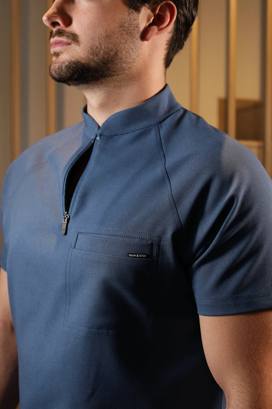 Close-up of Harry Indigo Scrub Top showing the high collar and zipper neckline