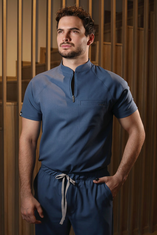 Model wearing Harry Indigo Scrub Top with matching Harry Scrub Pants