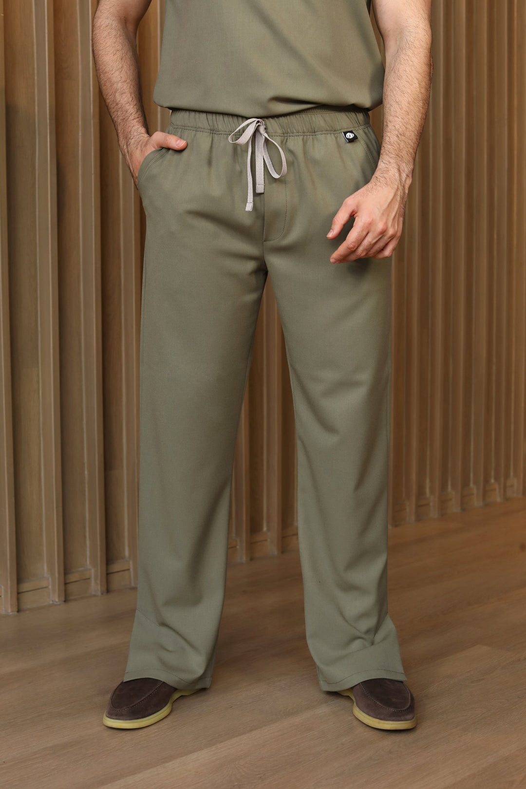 Man wearing Harry Olive Scrub Pants by Work &amp; Chill