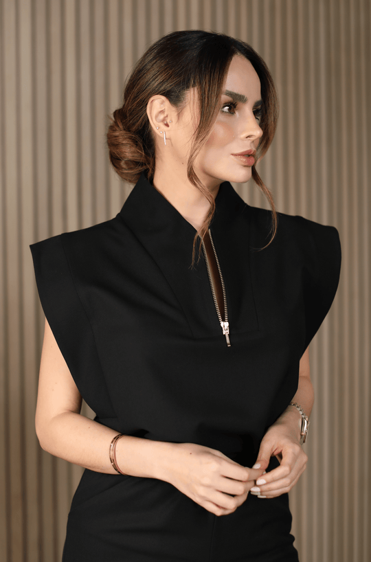 Woman wearing Kate Black Scrub Top by Work &amp; Chill