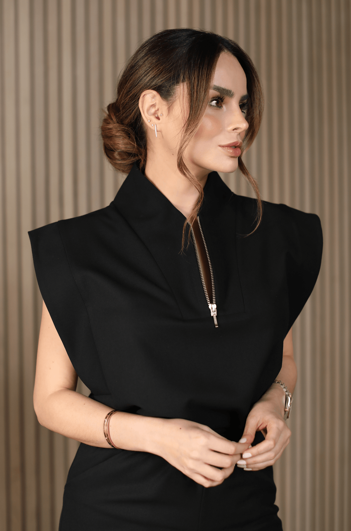 Woman wearing Kate Black Scrub Top by Work & Chill