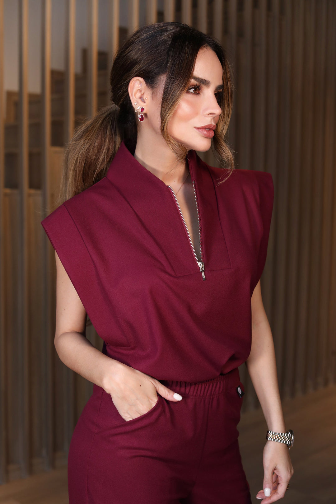 Side view of Kate Burgundy Scrub Top showing the structured fit
