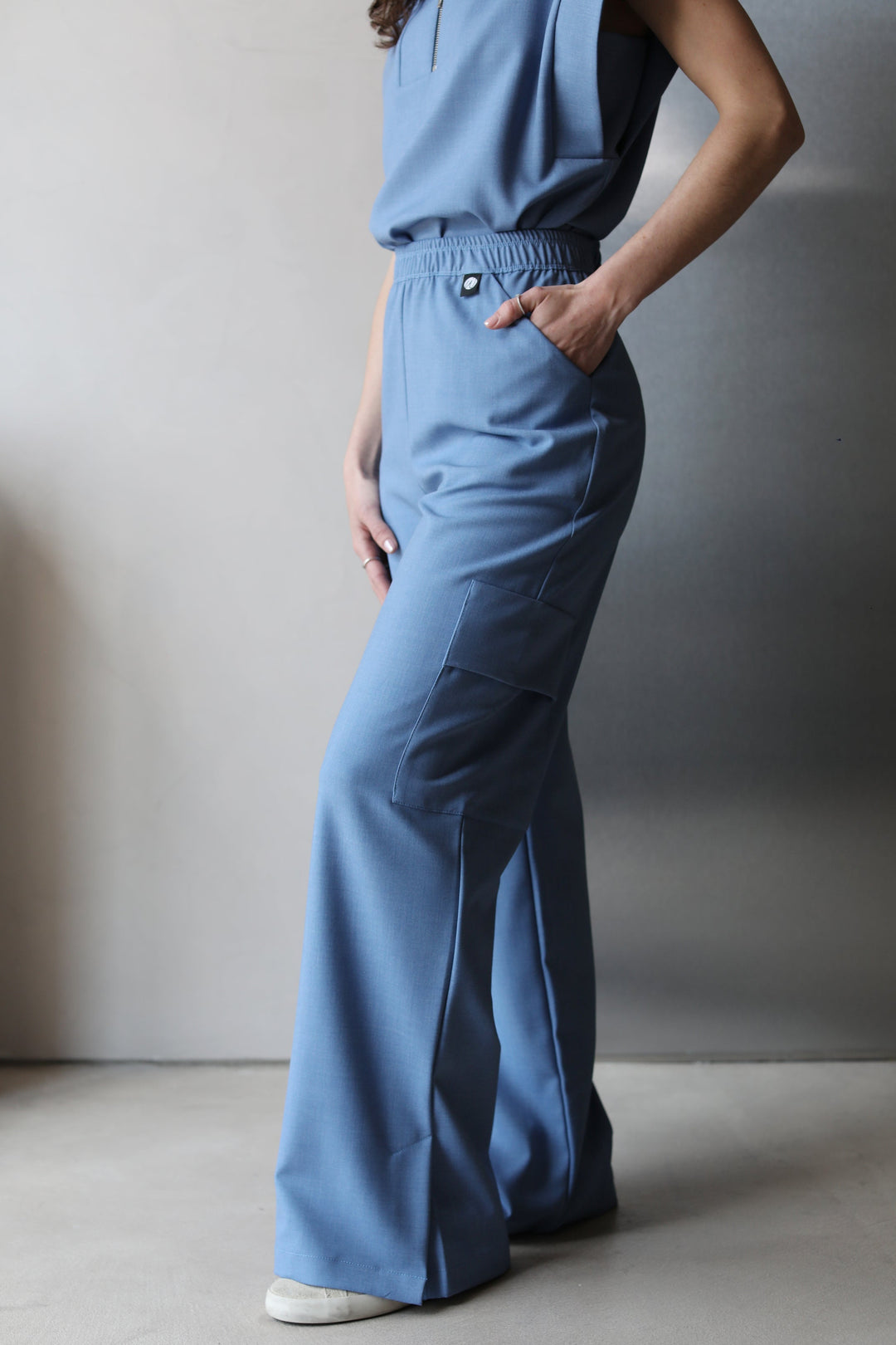 Side view of Kate Chambray Scrub Pants featuring a wide-leg silhouette