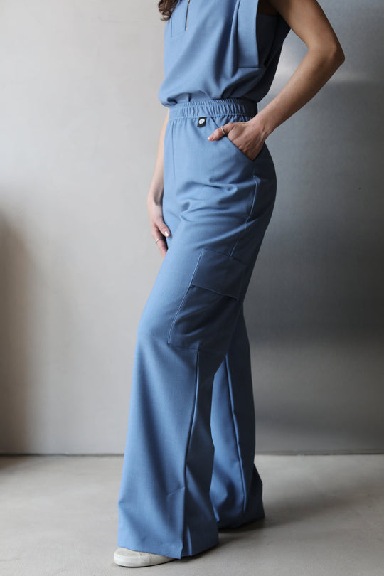 Side view of Kate Chambray Scrub Pants featuring a wide-leg silhouette