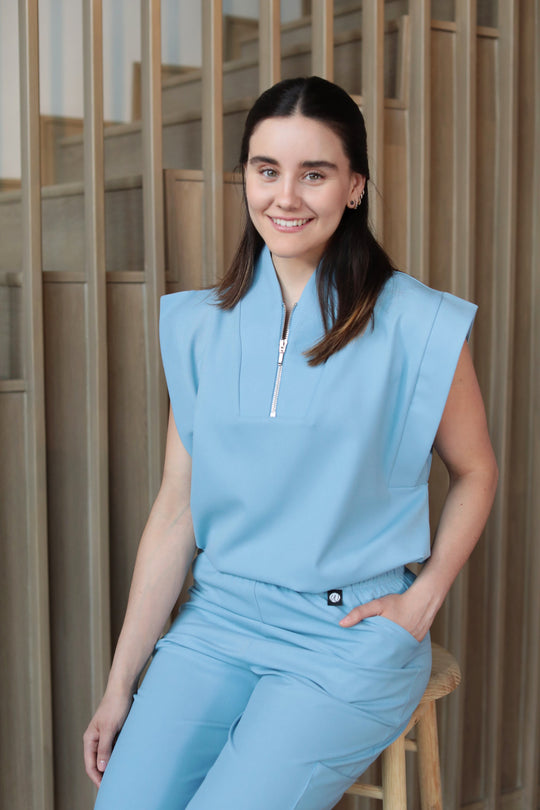 Kate Dream Blue Scrub Top styled with matching scrub pants