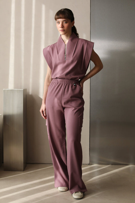 Woman wearing Kate Mauve Scrub Pants by Work &amp; Chill