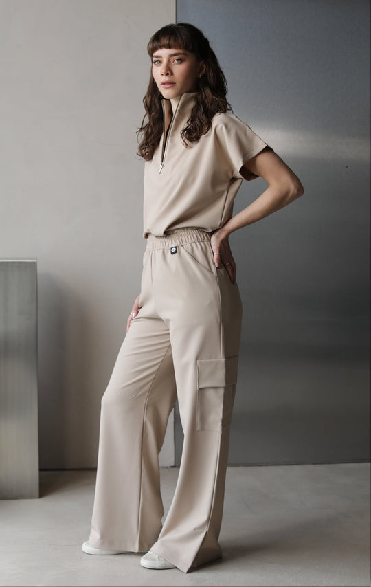 Side view of Victory Natural Scrub Top showing the relaxed fit