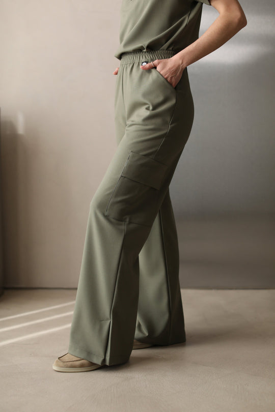 Side view of Kate Olive Scrub Pants showing the wide-leg silhouette