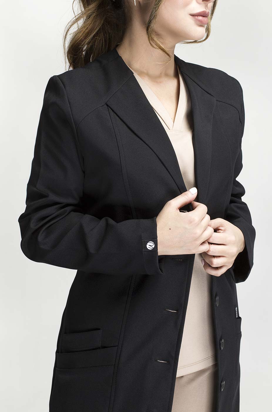 Front view of Women’s Black Medic Coat showing the tailored fit and long sleeves