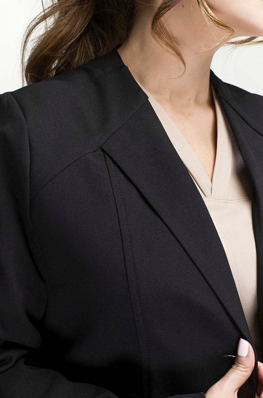 Close-up of Women’s Black Medic Coat showing the lapel and antifluid fabric