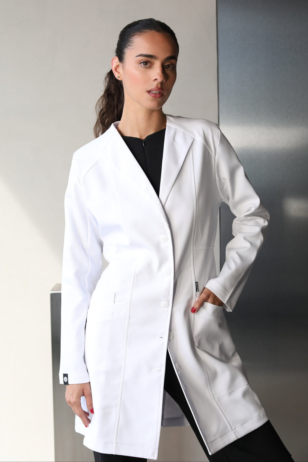 Full-body view of model wearing Women’s Medic Coat in White