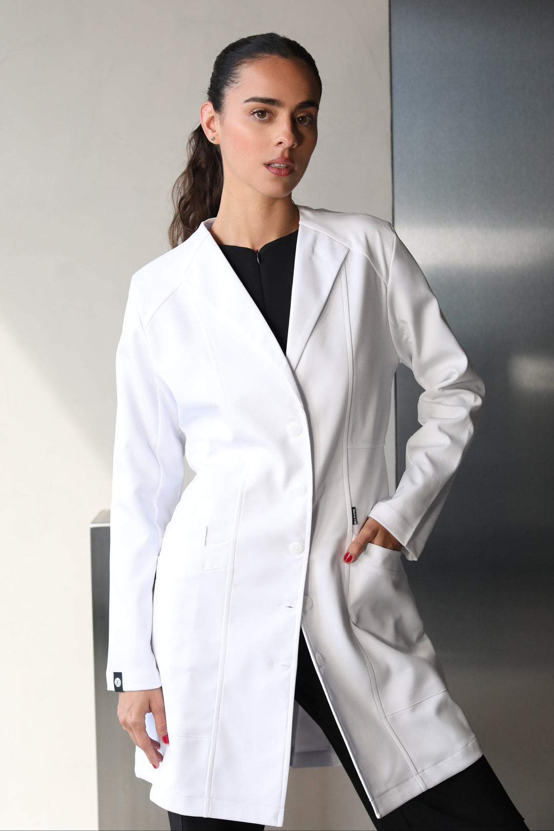 Full-body view of model wearing Women’s Medic Coat in White