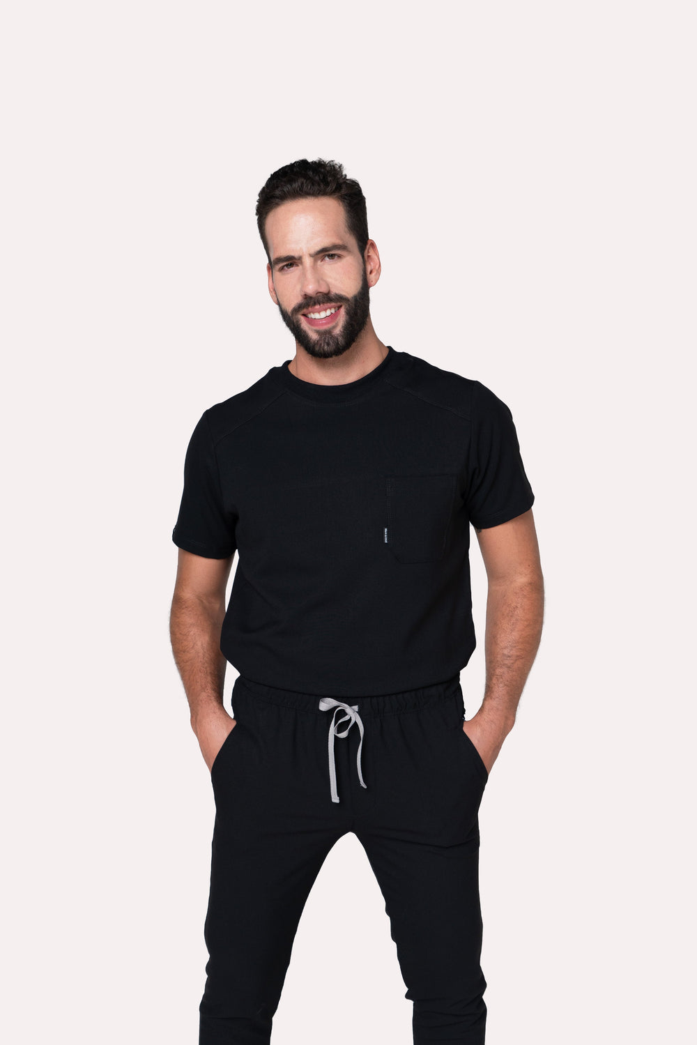 Model wearing Sport Black Scrub Top with black scrub pants