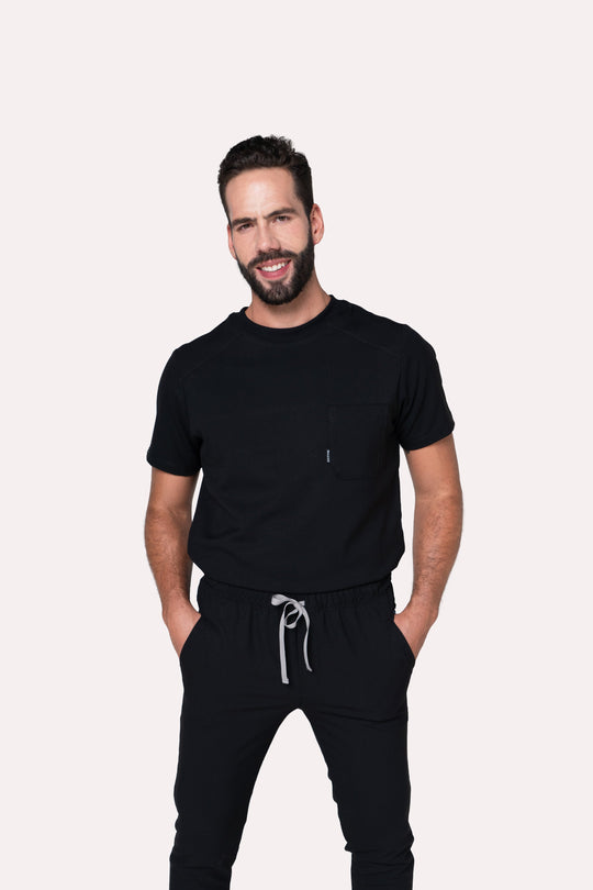 Model wearing Sport Black Scrub Top with black scrub pants