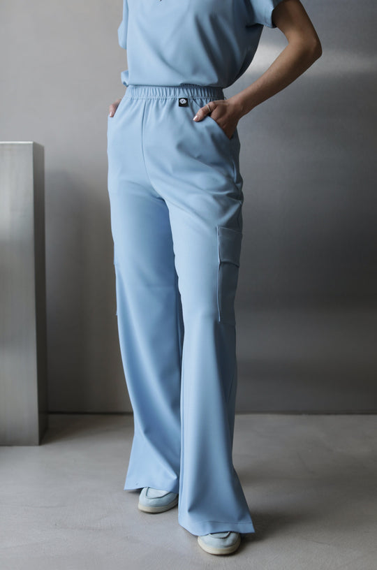 Side view of Victory Dream Blue Scrub Top showing the relaxed fit