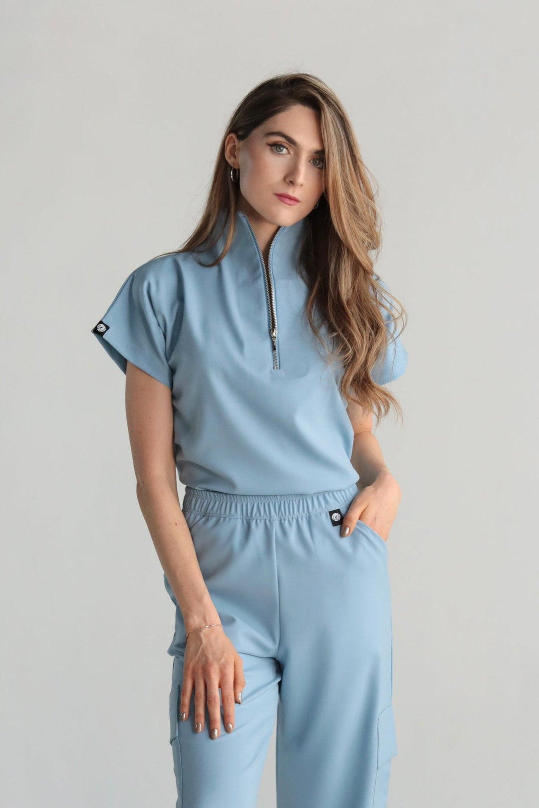 Front view of Victory Dream Blue Scrub Top showing the relaxed fit