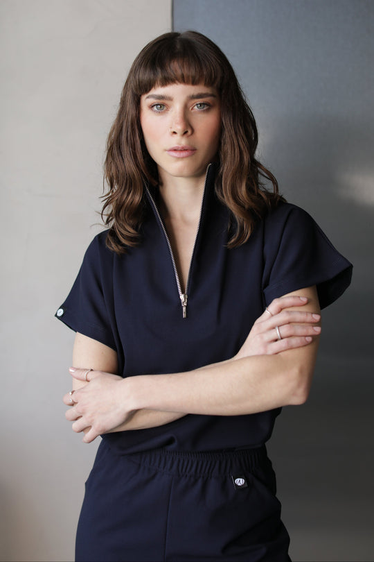 Front view of Victory Navy Scrub Top showing its relaxed silhouette