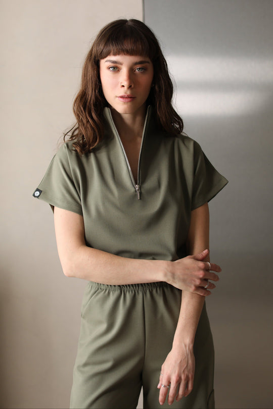 Front view of Victory Olive Scrub Top showing the relaxed fit