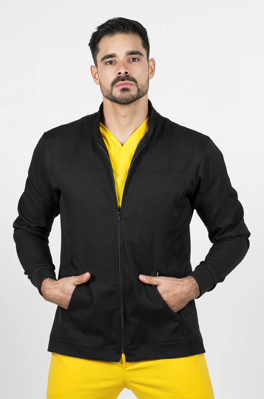 Man wearing Men’s Black Work Coat showing the antifluid fabric and functional design
