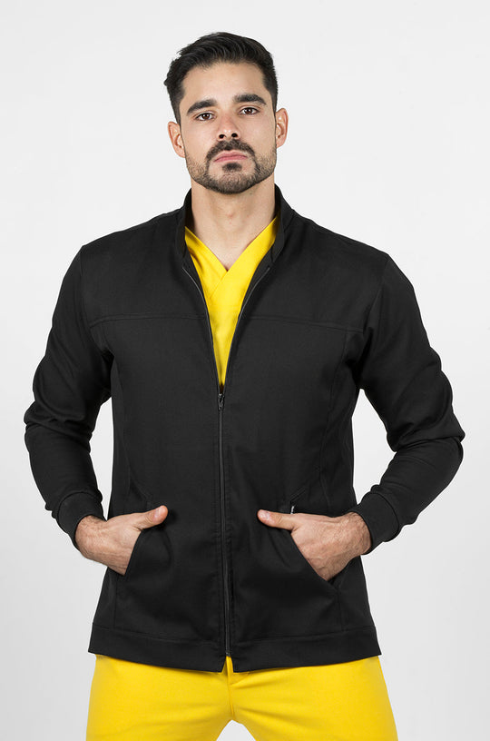 Man wearing Men’s Black Work Coat showing the antifluid fabric and functional design