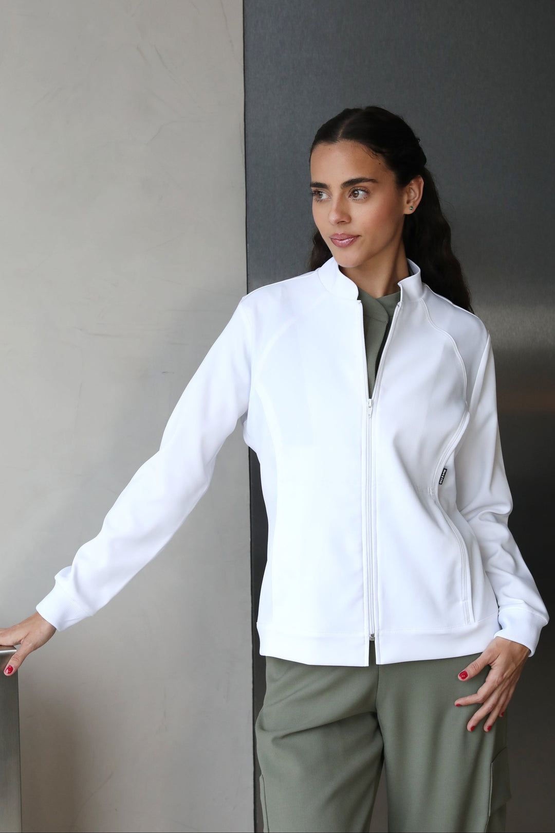 Three-quarter view of Women’s White Medic Coat showing the tailored medical fit
